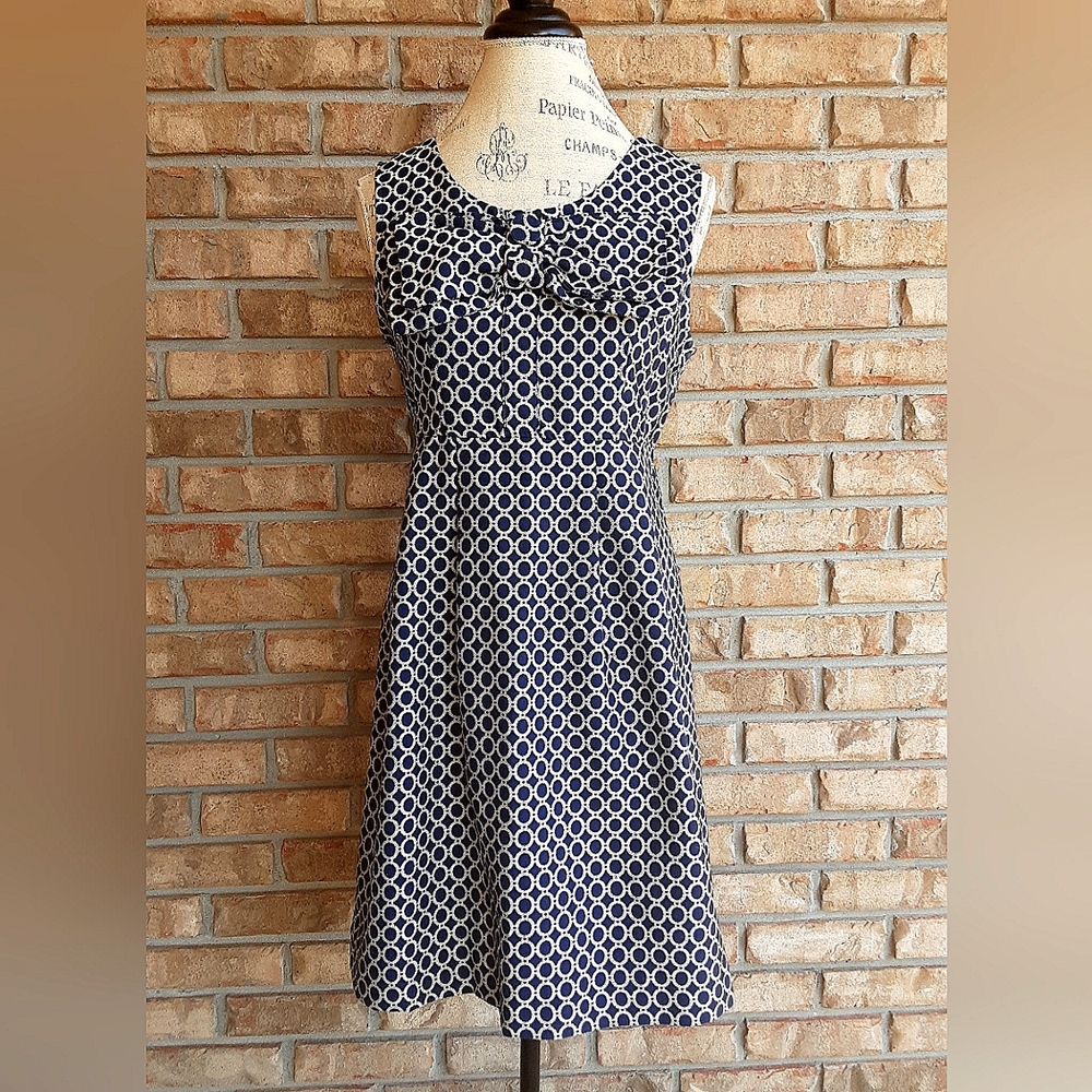 Mieko Mellucci Geometric Print Sleeveless Dress with Bow Detail.